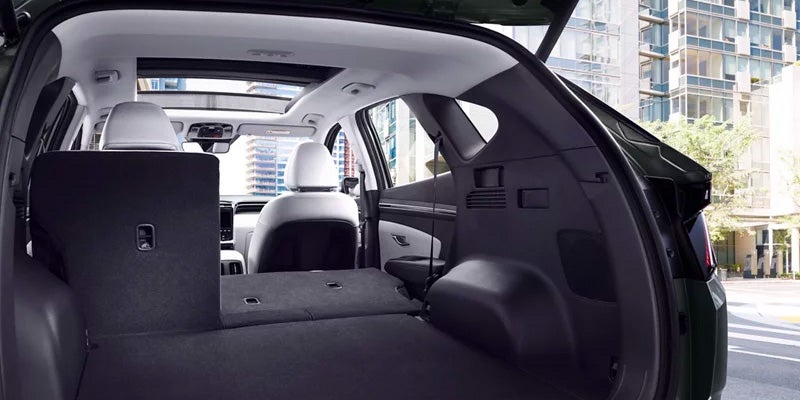 The back seats and truck storage of a Hyundai Tuscon
